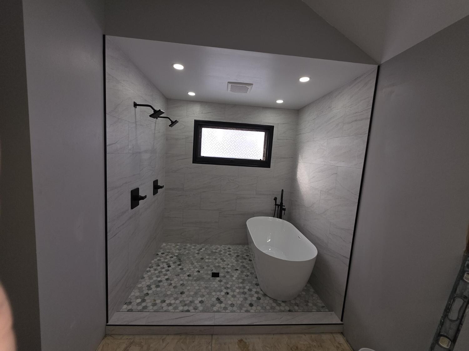 Open wet room with freestanding tub